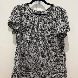 Black white and yellow floral top, slightly sheet